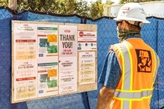 Construction worker at a jobsite wearing a mask.