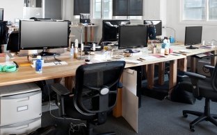 Communal desks in an open-floor office space. 