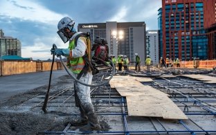 Group of people working on a concrete pour 