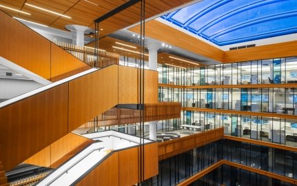 Staircase overlooking several floors of offices. 