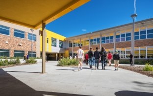 Students enter Beveridge Magnet Middle School in Omaha, NE.