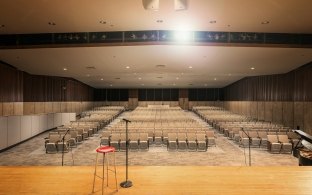 An empty auditorium viewed from center stage.