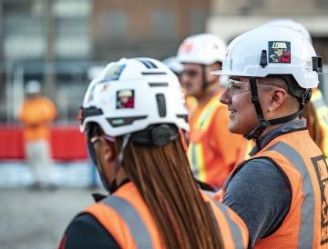 People at meeting on jobsite.