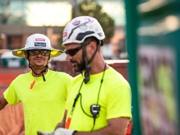 Person inspecting construction work.