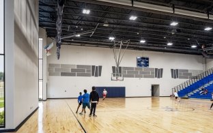 People at a basketball court in the gym