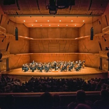 Chapman University Musco Center for the Arts Stage with Orchestra, Conductor and Audience Watching