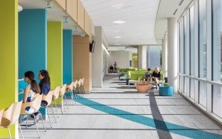 A hallway with chairs on one side and colorful wall panels