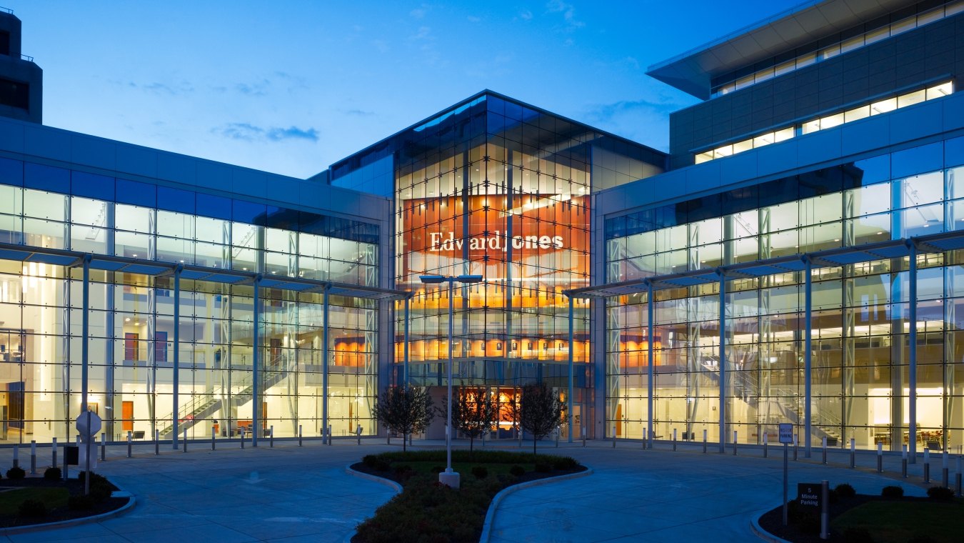 Looking into Edward Jones South Campus building windows at dusk