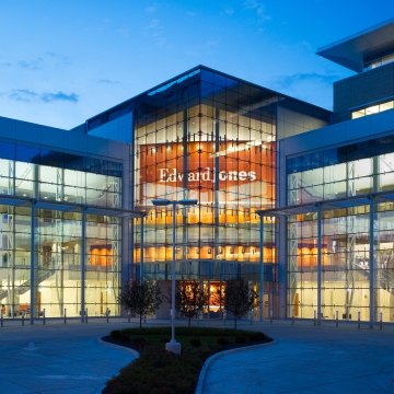 Looking into Edward Jones South Campus building windows at dusk