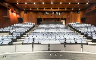 View of the performance hall standing on the stage and looking out toward the audience seating.