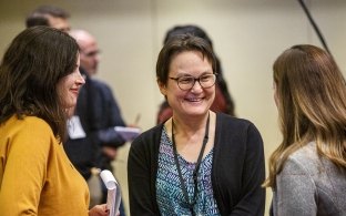 employees smiling and talking