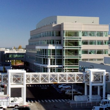 Exterior view of a building with a walkway in front. 