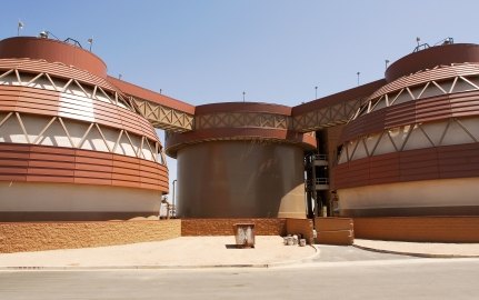 The futuristic brown and beige tanks at the Greenfield Water Reclamation Facility. 