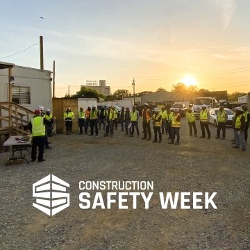 Team of construction workers celebrating Construction Safety Week.