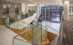 View from the top of a staircase looking over the open floor plan