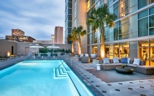 Outdoor image of the pool with couch seating