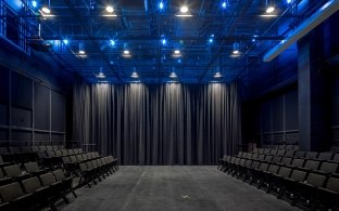 A darkened but well-lit room at Kinder Auditorium.