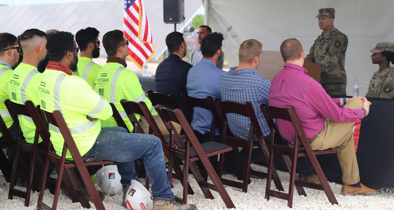 Soldiers talking to an audience.