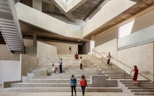 Indoor image of stairs leading to multiple staircases