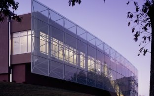 Outdoor image of the front of the building which is all glass