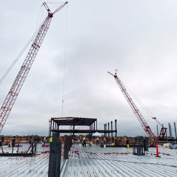 Two cranes tower of the Next NGA West facility under construction in St. Louis, Missouri. 