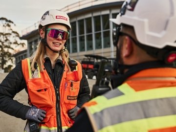 employees talking on a jobsite