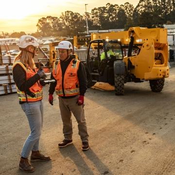 Employees talking on jobsite