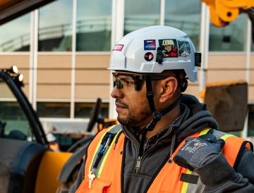 employee on jobsite looking away from camera