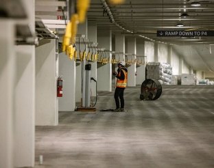 Person inspecting parking spots. 