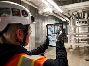 Person inspecting construction work.