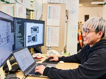 employee at computer with data