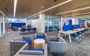 An open area with tables and chairs for lounging or studying. 