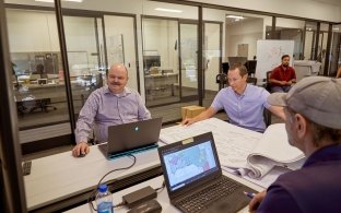 People in the Las Vegas office having a meeting.