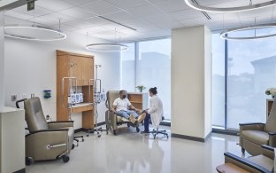 Two people in a patient room