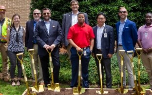 People with shovels at groundbreaking event