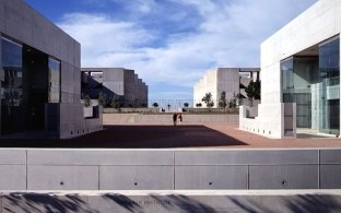 Outdoor area between two buildings with concrete and glass