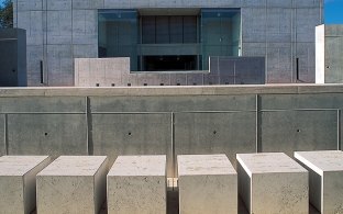 Outdoor entrance to the building that is all concrete