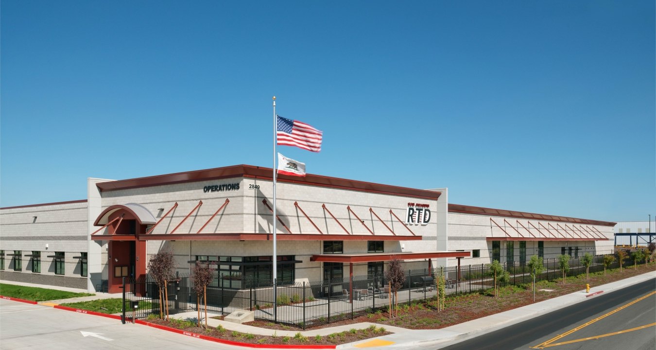 San Joaquin Regional Transit District Bus Maintenance, Fueling and Wash Station Exterior with US Flag