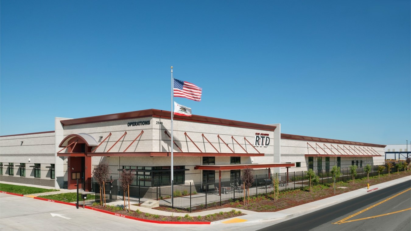 San Joaquin Regional Transit District Bus Maintenance, Fueling and Wash Station Exterior with US Flag