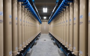 Pipes along the walls inside the water treatment facility