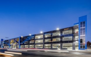 Exterior view of the parking garage at night.