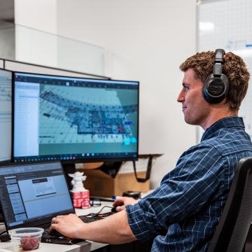 Person working at computer.