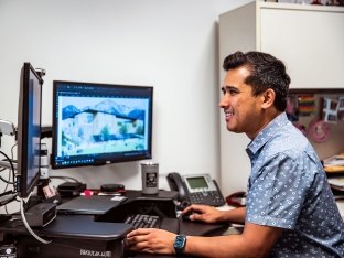 Person working at computer.