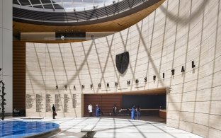 View of the entryway to the hospital with a curved wall and rectangular opening