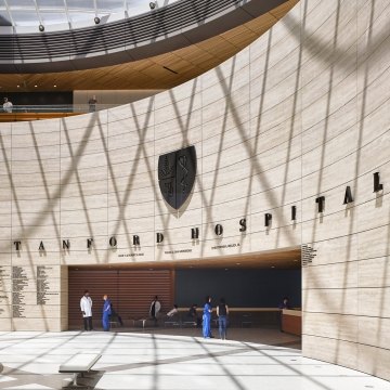 View of the entryway to the hospital with a curved wall and rectangular opening