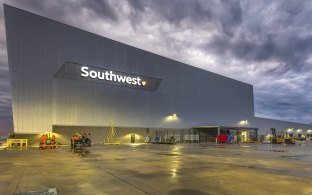 Exterior view of the hangar at nighttime with Southwest sign