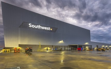 Exterior view of the hangar at nighttime with Southwest sign