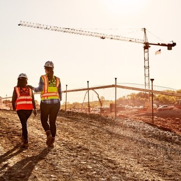 Construction workers walking around a jobsite.