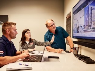 People in an office having a meeting.