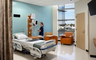 Patient room with monitors and a bed